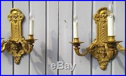 A pair of French Louis XV fire gilt bronze wall appliques, elec. Candle holders