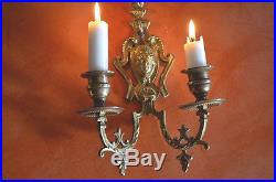 A pair of antique French solid bronze 2 armed wall sconces/candle holders