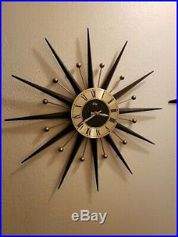 Antique Welby Starburst clock with matching candle holders