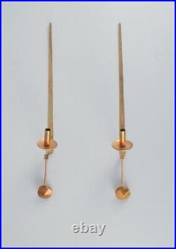 Skultuna, Sweden, a pair of brass candlesticks for wall hanging