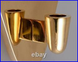 Thomas Sandell for Skultuna. Two wall-mounted candle holders in polished brass
