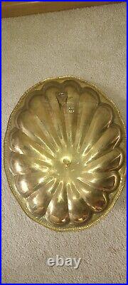 Vintage brass shell double candle arm wall sconce